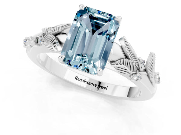Platinum Emerald Cut Aquamarine Solitaire Ring with Leaf Motif Band and Four-Prong Setting