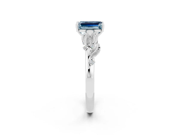 Platinum Emerald Cut Aquamarine Solitaire Ring with Leaf Motif Band and Four-Prong Setting