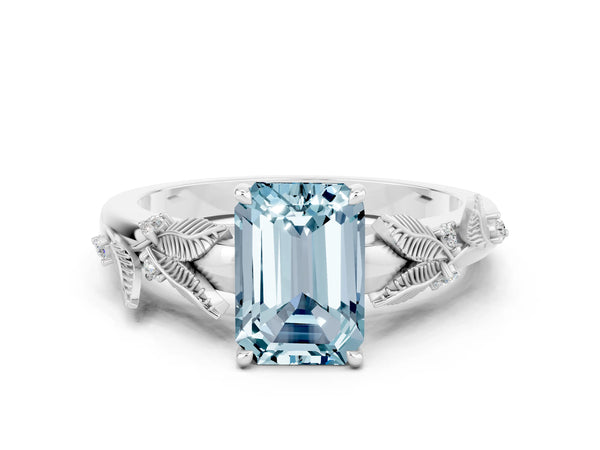 Silver Emerald Cut Aquamarine Solitaire Ring with Leaf Motif Band and Four-Prong Setting