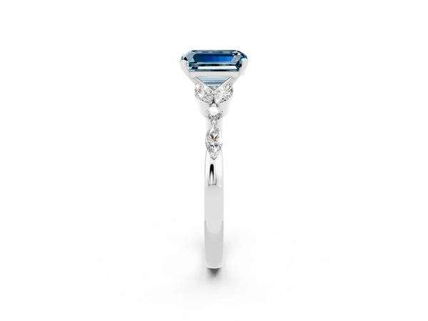 Silver Emerald Cut Aquamarine Solitaire Ring with Side Stones and Four-Prong Setting