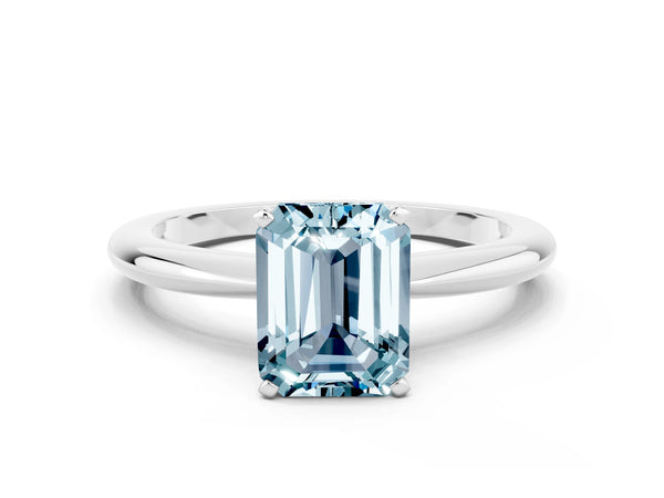 Platinum Emerald Cut Aquamarine Solitaire Ring with Six-Prong Setting and Classic Band
