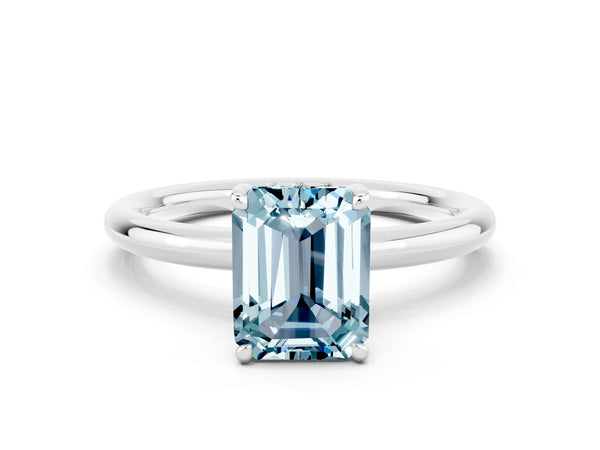 Platinum Emerald Cut Aquamarine Solitaire Ring with Thin Band and Four-Prong Setting