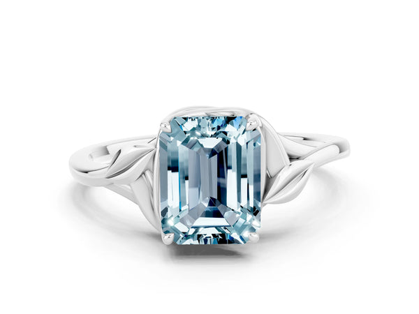White gold Emerald Cut Aquamarine Solitaire Ring with Twist Band and Four-Prong Setting
