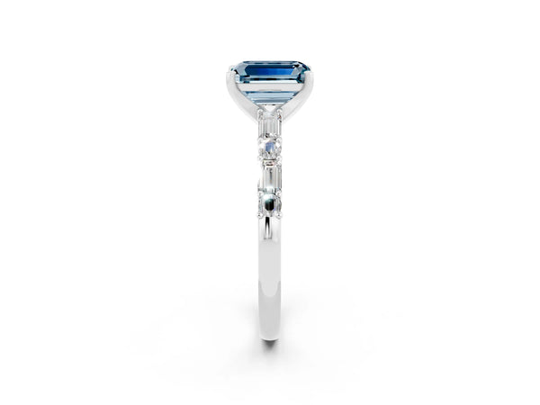 Platinum Emerald Cut Aquamarine Solitaire with Side Baguettes and Channel Set Band