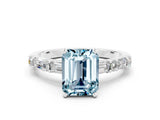 White gold Emerald Cut Aquamarine Solitaire with Side Baguettes and Channel Set Band