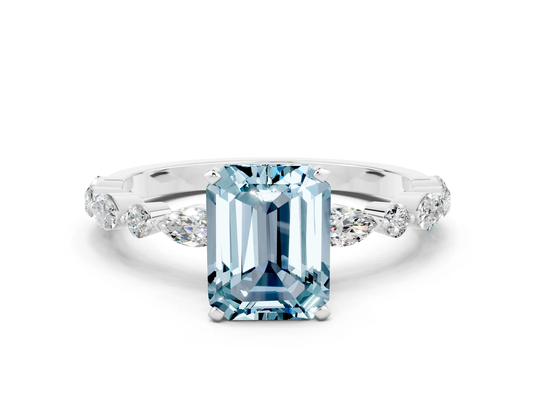 White gold Emerald Cut Aquamarine Solitaire with Side Stones on a Pavé Band and Four-Prong Setting
