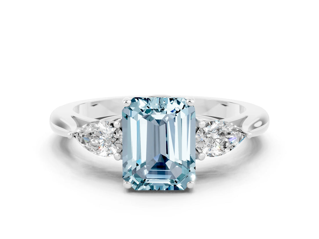 Platinum Aquamarine Three-Stone Ring with Pear Side Stones and Prong Setting