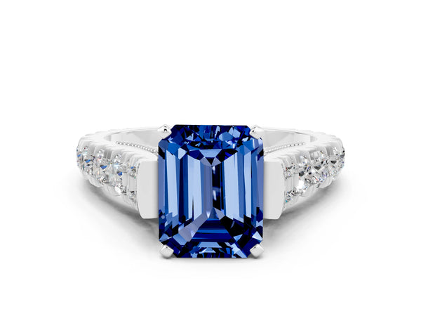 Platinum Emerald Cut Blue Sapphire Classic Solitaire Ring with Pavé Band and Four-Prong Setting
