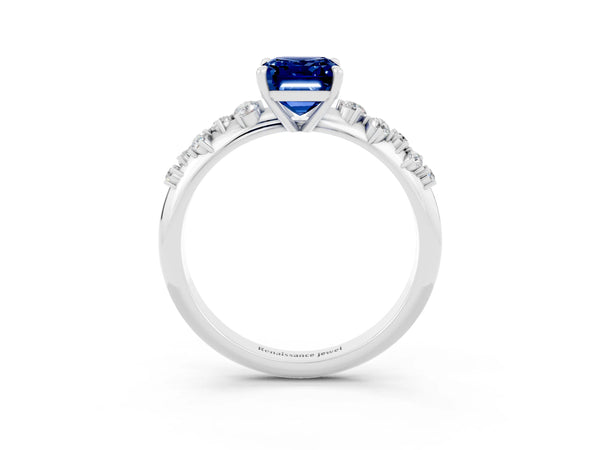 Platinum Emerald Cut Blue Sapphire Cluster Side Stone Solitaire Ring with Prong Setting