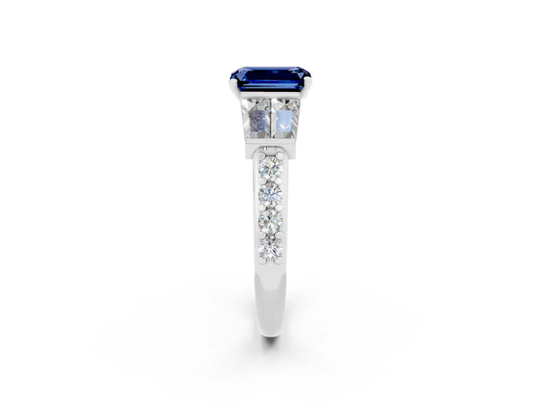 White gold Emerald Cut Blue Sapphire Engagement Ring with Baguette Side Stones and Channel Set Band