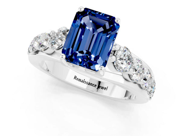 White gold Emerald Cut Blue Sapphire Engagement Ring with Pavé Band and Four-Prong Setting