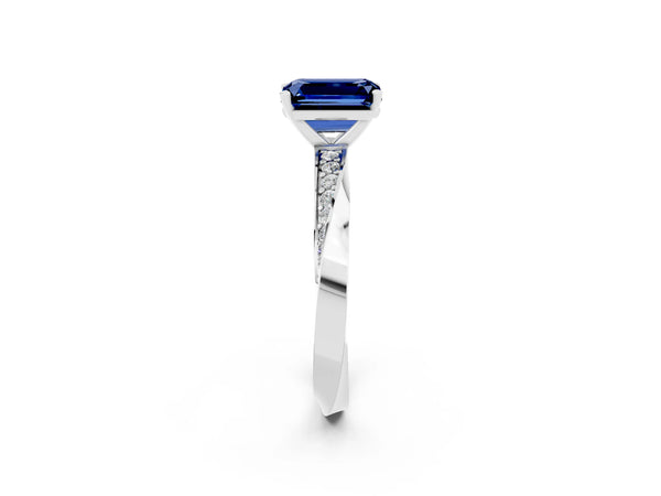 White gold Emerald Cut Blue Sapphire Engagement Ring with Side Stone Accents and Four-Prong Setting