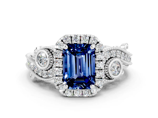 White gold Emerald Cut Blue Sapphire Halo Ring with Milgrain Pavé Band and Four-Prong Setting