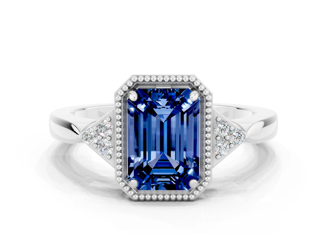 White gold Emerald Cut Blue Sapphire Halo Ring with Tapered Band and Four-Prong Setting
