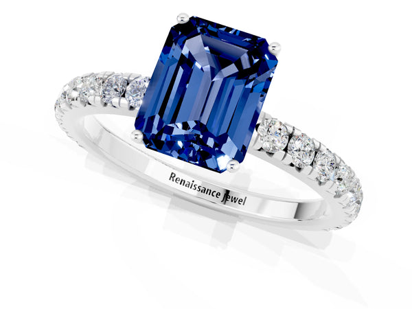 Silver Emerald Cut Blue Sapphire Pavé Solitaire Engagement Ring with Four-Prong Setting