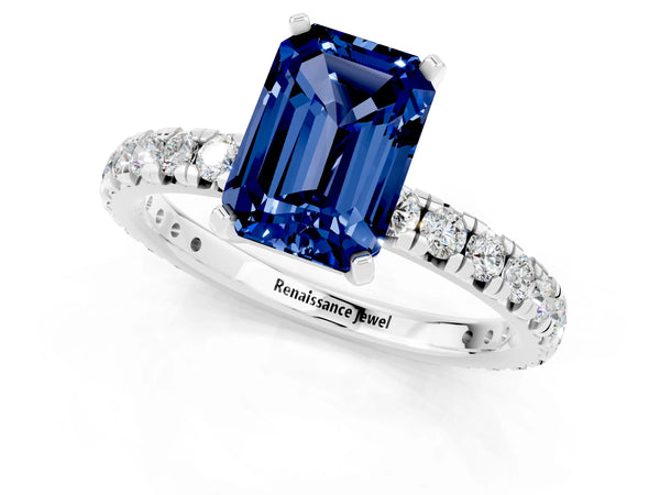 Platinum Emerald Cut Blue Sapphire Pavé Solitaire Ring with Round Band and Prong Setting