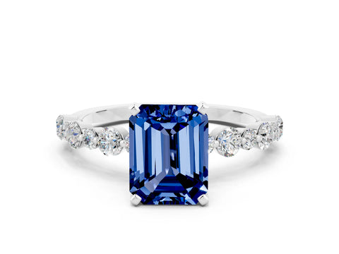 White gold Emerald Cut Blue Sapphire Prong Set Engagement Ring with Pavé Band