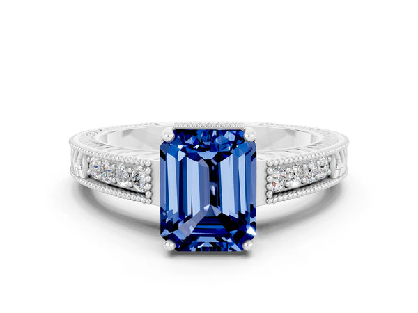 White gold Emerald Cut Blue Sapphire Ring with Milgrain Pavé Band and Four-Prong Setting