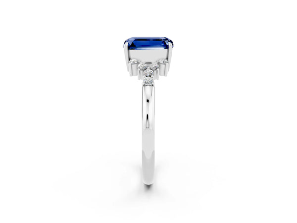 Platinum Emerald Cut Blue Sapphire Ring with Side Stones and Four-Prong Setting