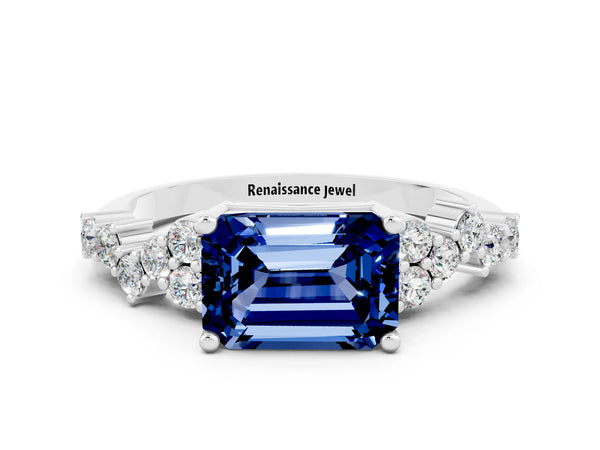 Platinum Emerald Cut Blue Sapphire Scattered Round Accent Ring with Prong Setting