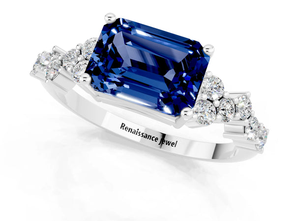 Platinum Emerald Cut Blue Sapphire Scattered Round Accent Ring with Prong Setting