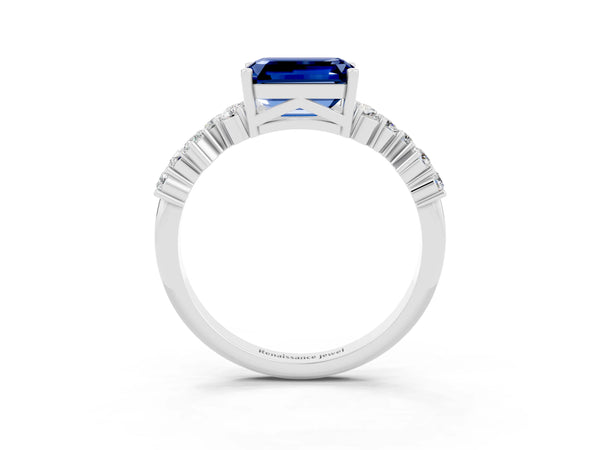 Platinum Emerald Cut Blue Sapphire Scattered Round Accent Ring with Prong Setting