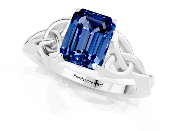 White gold Emerald Cut Blue Sapphire Solitaire Celtic Knot Ring with Four-Prong Setting