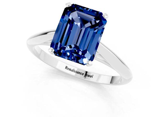 Silver Emerald Cut Blue Sapphire Solitaire Engagement Ring with Cathedral Setting and Four-Prong Mount