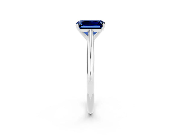 Platinum Emerald Cut Blue Sapphire Solitaire Engagement Ring with Cathedral Setting and Four-Prong Mount