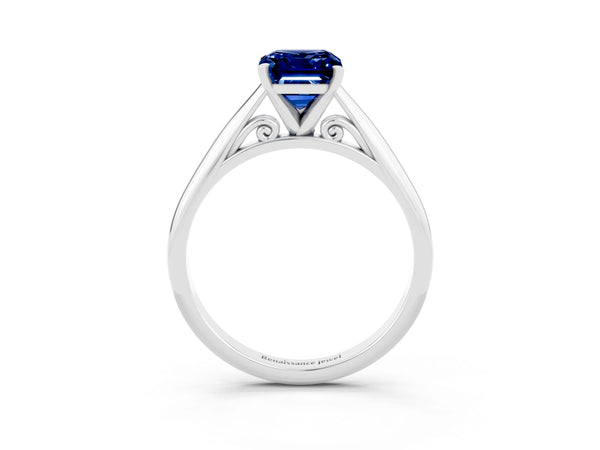 Silver Emerald Cut Blue Sapphire Solitaire Engagement Ring with Cathedral Setting and Four-Prong Mount