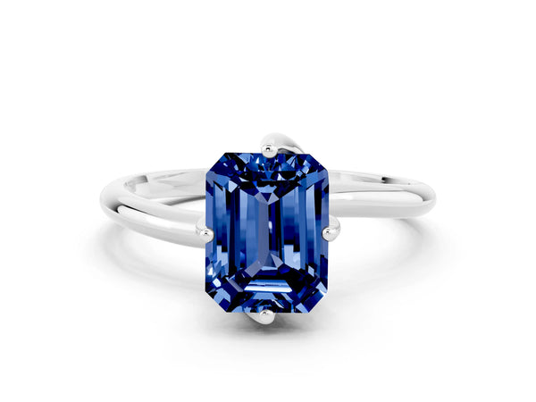 Platinum Emerald Cut Blue Sapphire Solitaire Engagement Ring with Four-Prong Setting and Classic Band