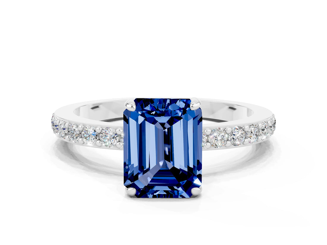White gold Emerald Cut Blue Sapphire Solitaire Engagement Ring with Pavé Band and Four-Prong Setting