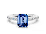 White gold Emerald Cut Blue Sapphire Solitaire Engagement Ring with Pavé Band and Four-Prong Setting