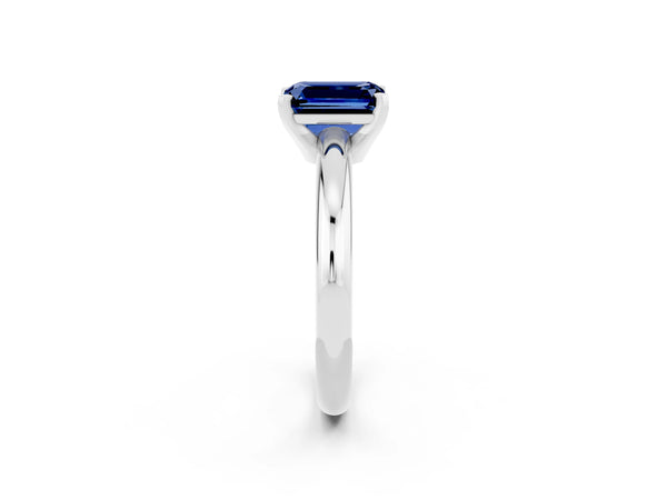 Silver Emerald Cut Blue Sapphire Solitaire Engagement Ring with Round Band and Four-Prong Setting
