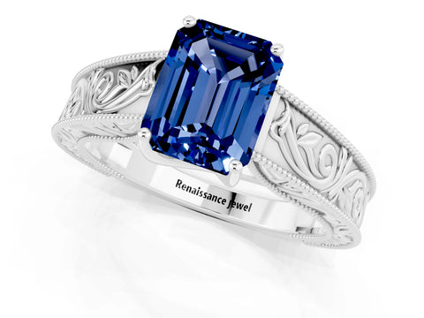 White gold Emerald Cut Blue Sapphire Solitaire Ring with Engraved Band and Four-Prong Setting_1