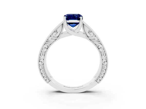 Silver Emerald Cut Blue Sapphire Solitaire Ring with Engraved Band and Four-Prong Setting