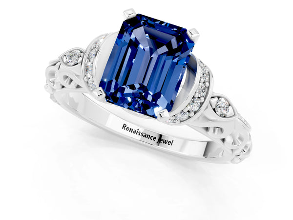 Platinum Emerald Cut Blue Sapphire Solitaire Ring with Filigree Band and Four-Prong Setting