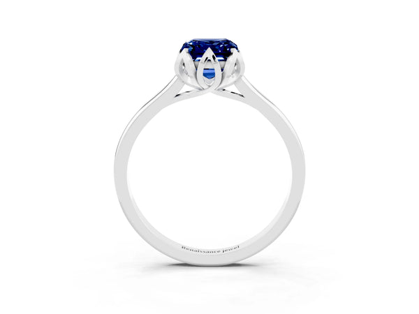 Silver Emerald Cut Blue Sapphire Solitaire Ring with Flower Prong Setting and Classic Band