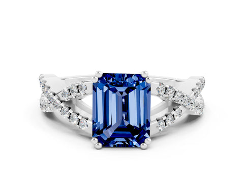 White gold Emerald Cut Blue Sapphire Solitaire Ring with Four-Prong Setting and Twisted Pavé Band