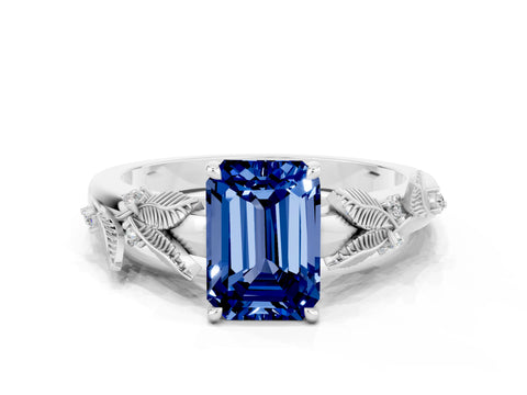 White gold Emerald Cut Blue Sapphire Solitaire Ring with Leaf Motif Band and Four-Prong Setting