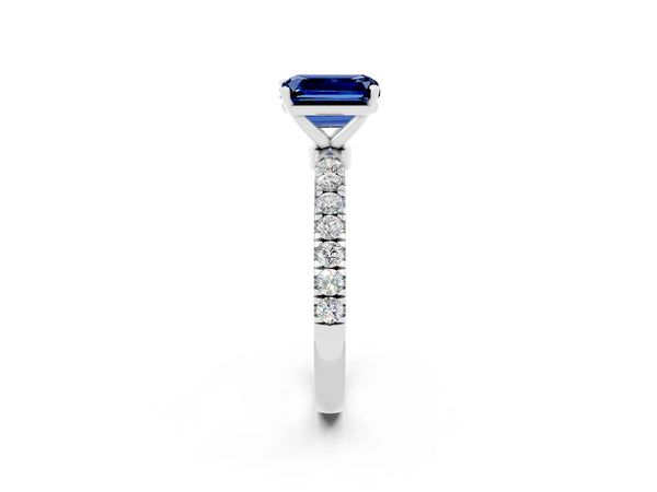 White gold Emerald Cut Blue Sapphire Solitaire Ring with Pavé Accents and Four-Prong Setting