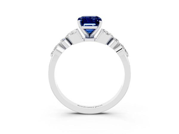 Platinum Emerald Cut Blue Sapphire Solitaire Ring with Side Stones and Four-Prong Setting