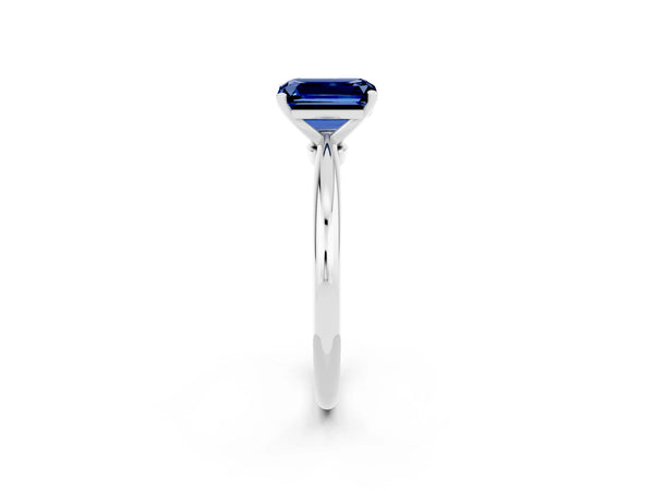 Platinum Emerald Cut Blue Sapphire Solitaire Ring with Six-Prong Setting and Classic Band