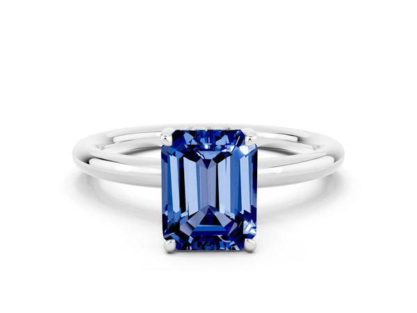Silver Emerald Cut Blue Sapphire Solitaire Ring with Thin Band and Four-Prong Setting