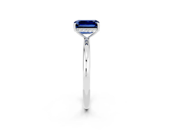 Platinum Emerald Cut Blue Sapphire Solitaire Ring with Thin Band and Four-Prong Setting