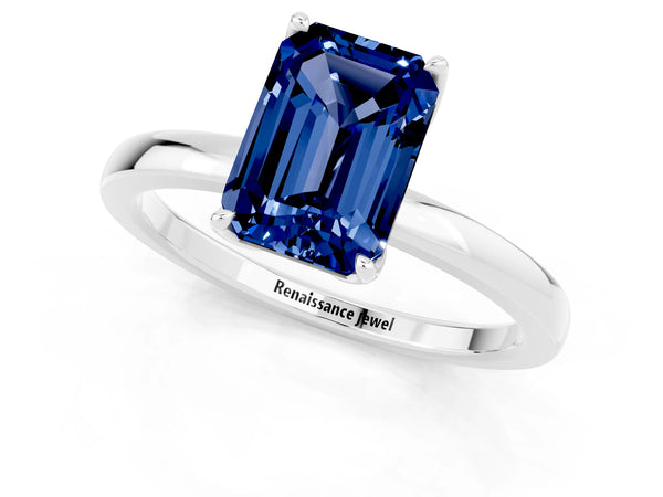 Platinum Emerald Cut Blue Sapphire Solitaire Ring with Thin Band and Prong Setting