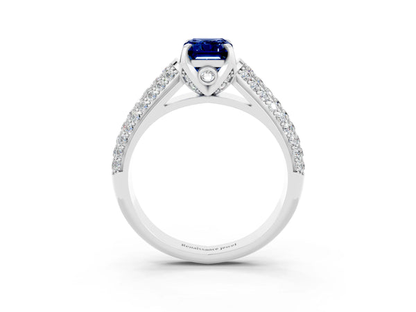 Platinum Emerald Cut Blue Sapphire Solitaire Ring with Three-Row Pavé Band and Four-Prong Setting