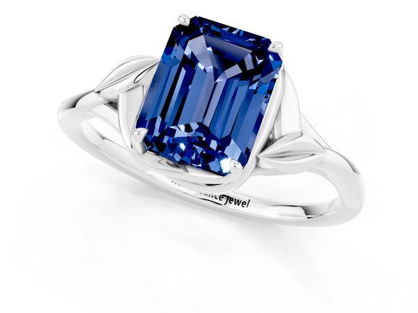 White gold Emerald Cut Blue Sapphire Solitaire Ring with Twist Band and Four-Prong Setting