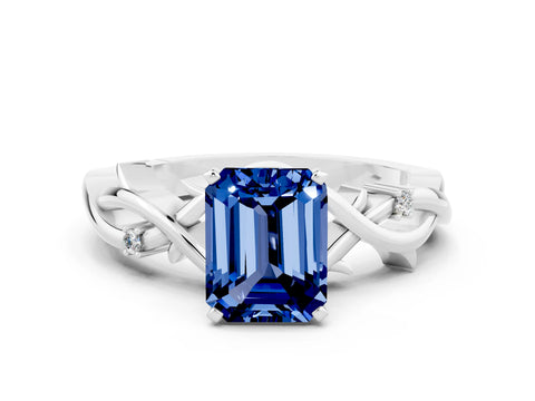 White gold Emerald Cut Blue Sapphire Solitaire Ring with Twisted Band and Prong Setting