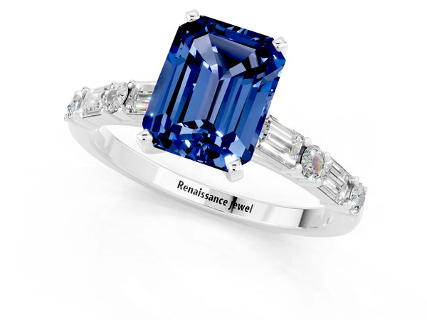 White gold Emerald Cut Blue Sapphire Solitaire with Side Baguettes and Channel Set Band